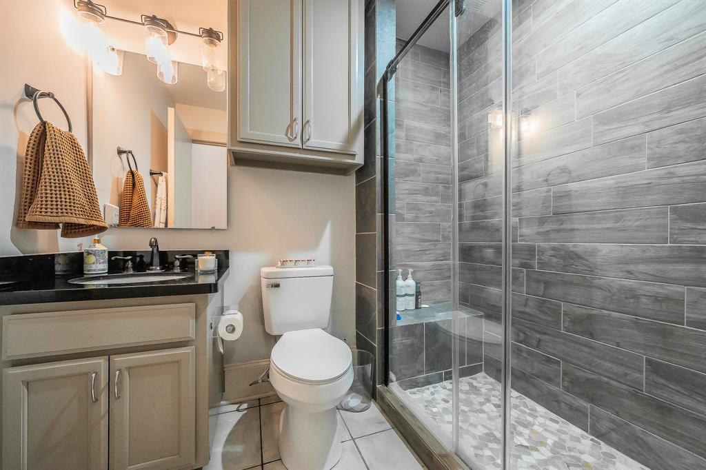 3911 Gilbert Avenue, Unit G Dallas, TX 75219 - Photo 8 of 35 a bathroom with a toilet and a sink