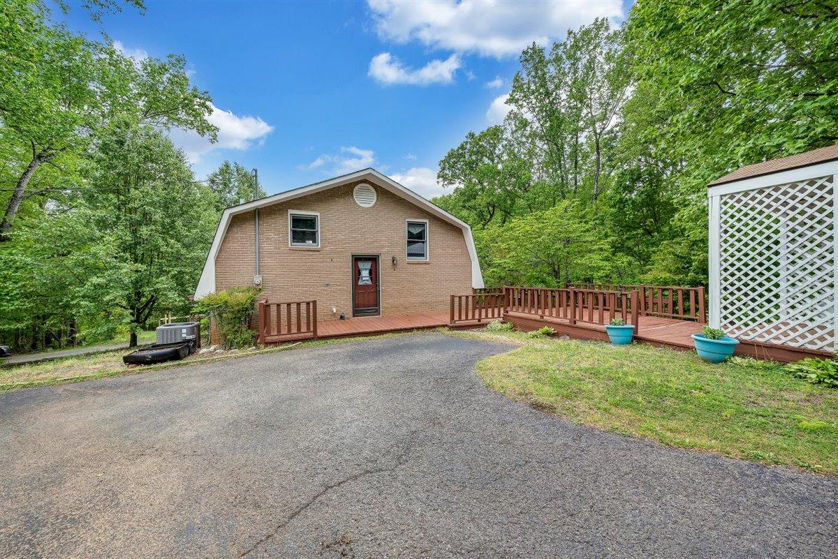 21 Mockingbird Road Boones Mill, VA 24065 - Photo 22 of 27 a view of a house with a yard and fence