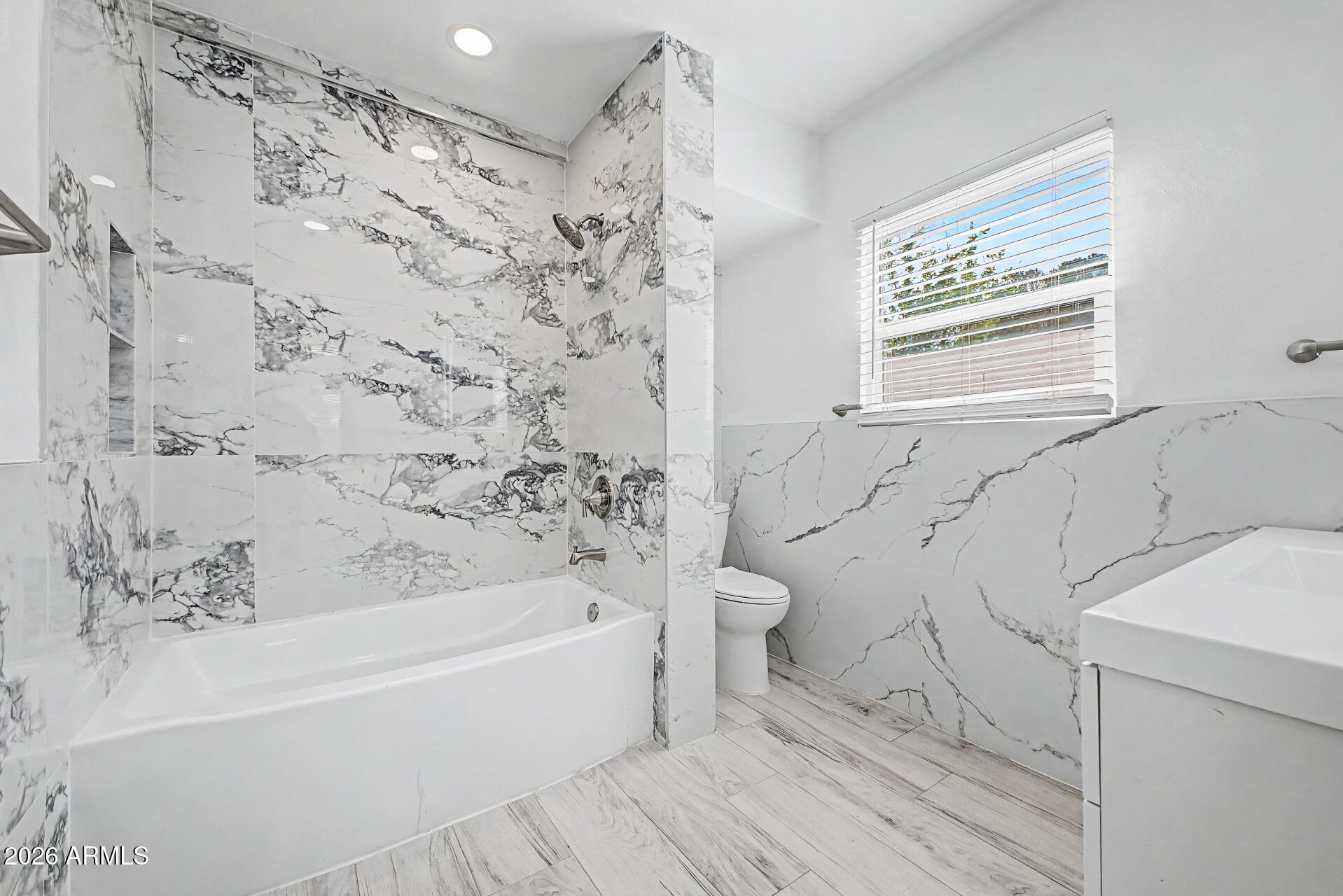 532 East Cheery Lynn Road Phoenix, AZ 85014 - Photo 18 of 37 a bathroom with a bathtub and a shower
