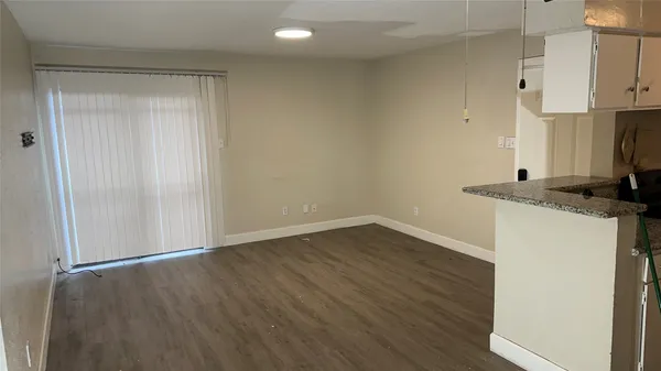 a view of kitchen with wooden floor
