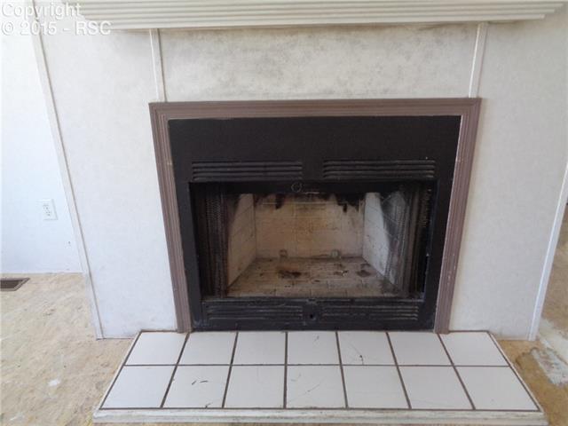 3182 Bar 10 Road Calhan, CO 80808 - Photo 11 of 25 Fireplace in the living room