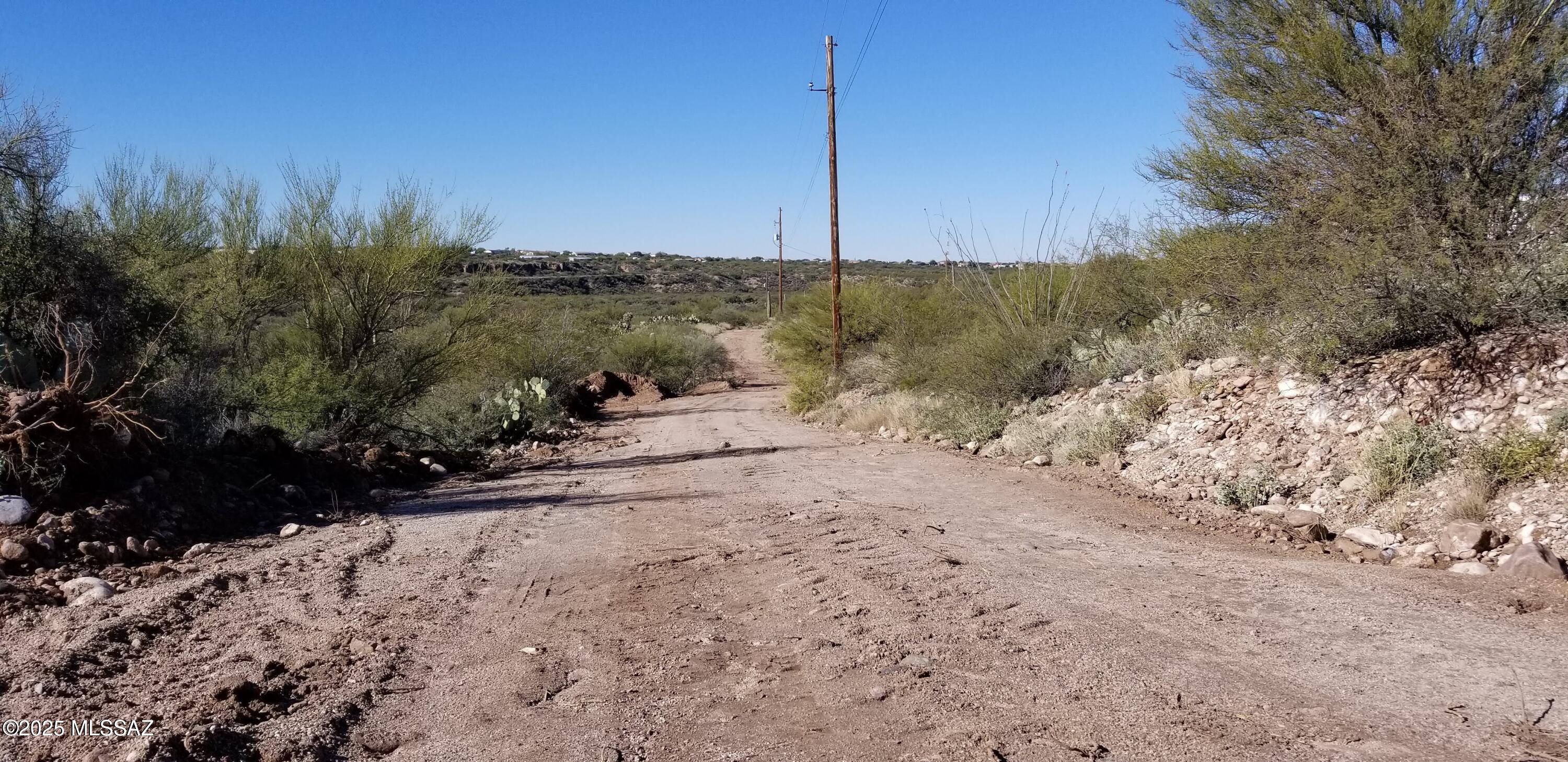 11640 South Lava Peak Road Vail, AZ 85641 - Photo 12 of 39 a view of a road with a building in the background