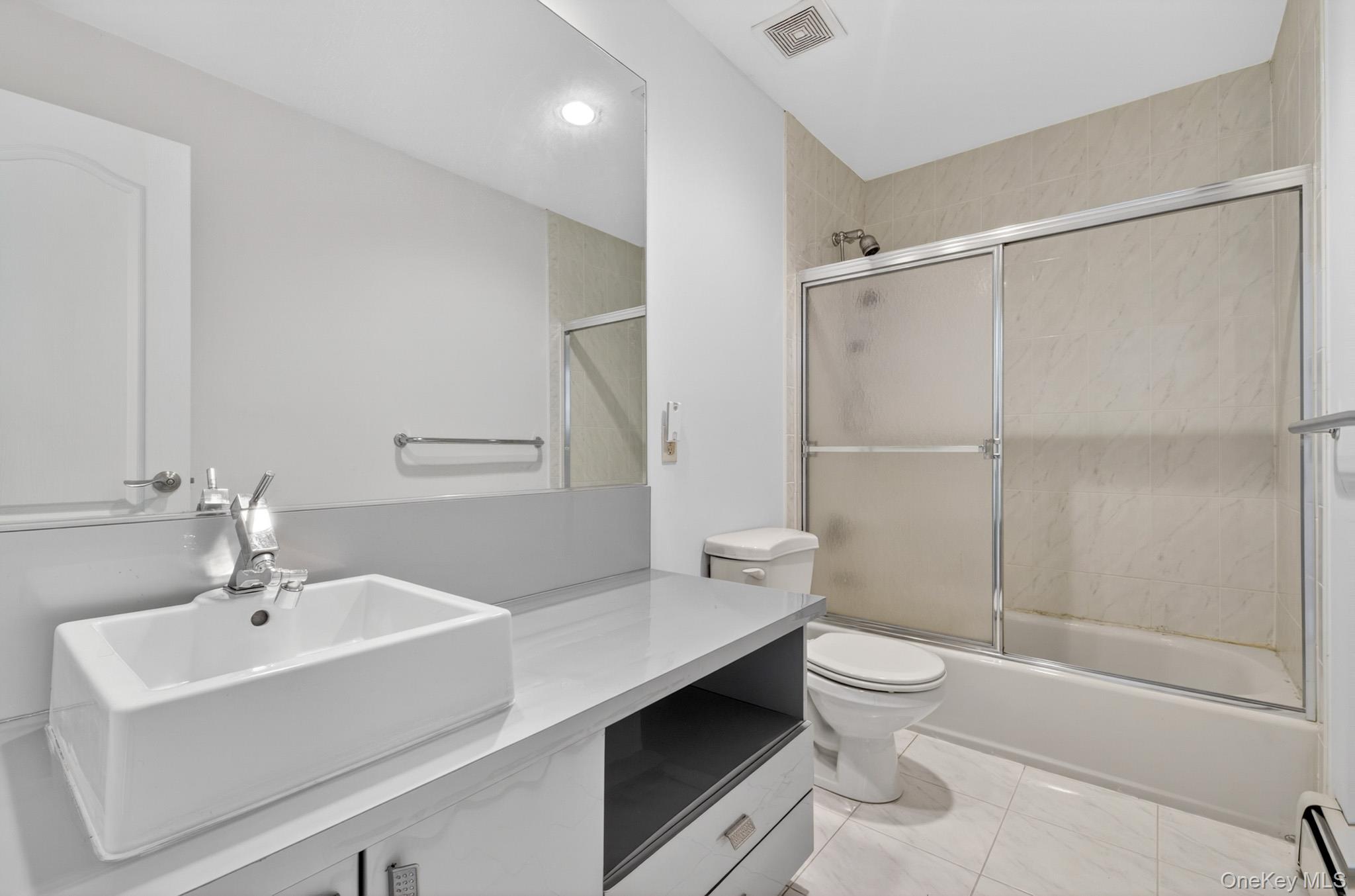 82 B Inwood Road Port Washington, NY 11050 - Photo 22 of 41 a bathroom with a sink toilet and shower