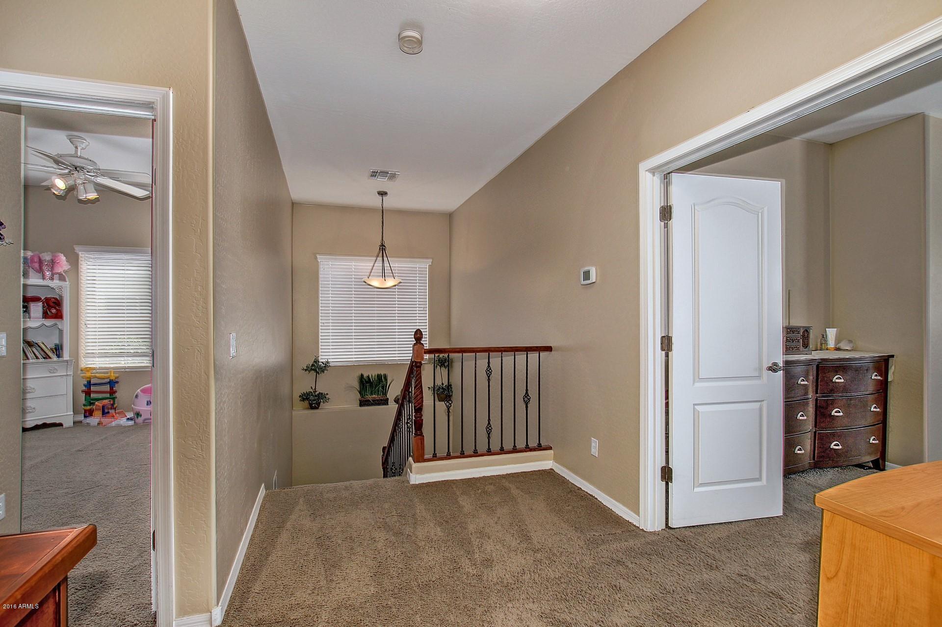 4165 East Los Altos Road Gilbert, AZ 85297 - Photo 24 of 44 UPGRADED RAILING DOWN TO BASEMENT