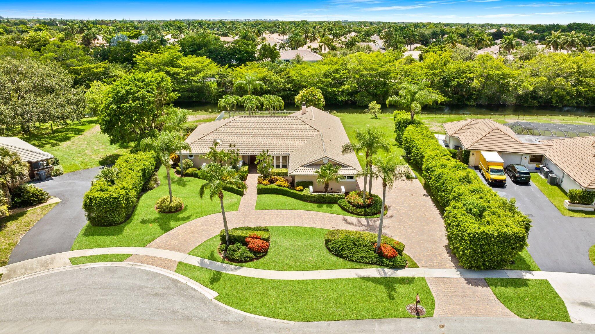 11937 Sandlake Drive Boca Raton, FL 33428 - Photo 1 of 54 a view of a garden