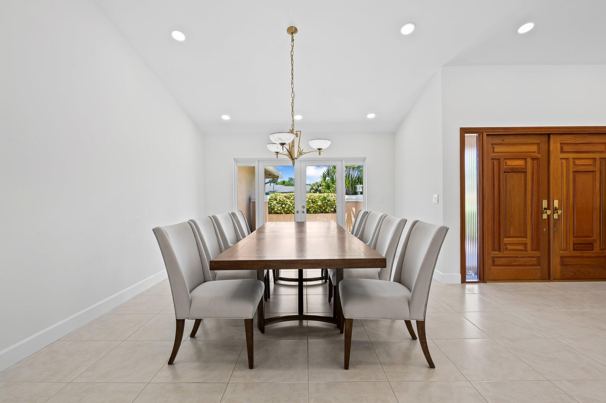 11937 Sandlake Drive Boca Raton, FL 33428 - Photo 18 of 54 a view of a dining room with furniture window and wooden floor