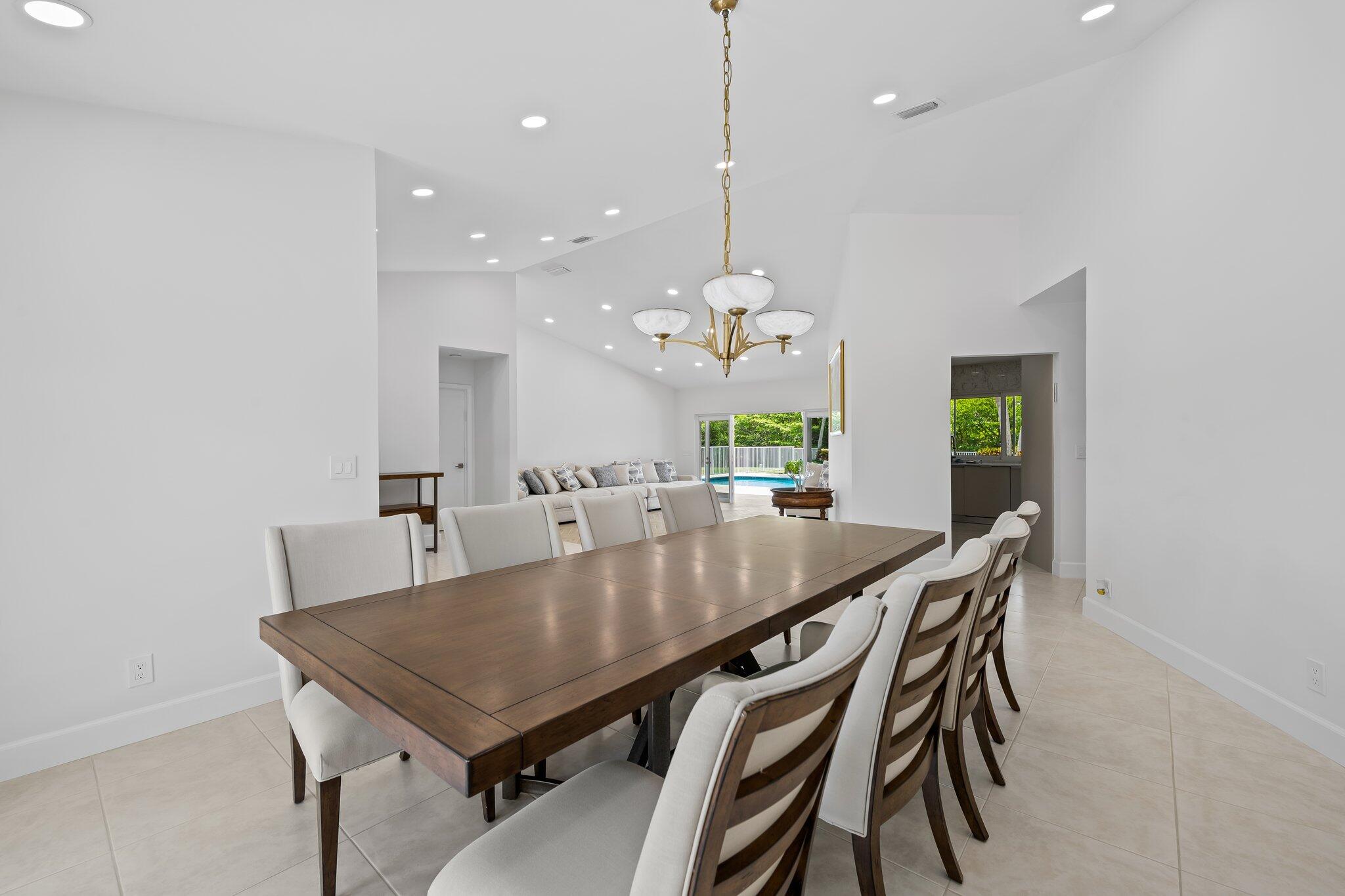 11937 Sandlake Drive Boca Raton, FL 33428 - Photo 19 of 54 a view of a dining room and livingroom