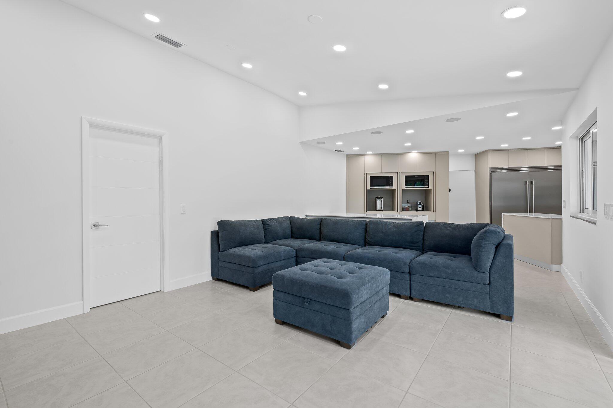 11937 Sandlake Drive Boca Raton, FL 33428 - Photo 25 of 54 a living room with furniture and a view of kitchen
