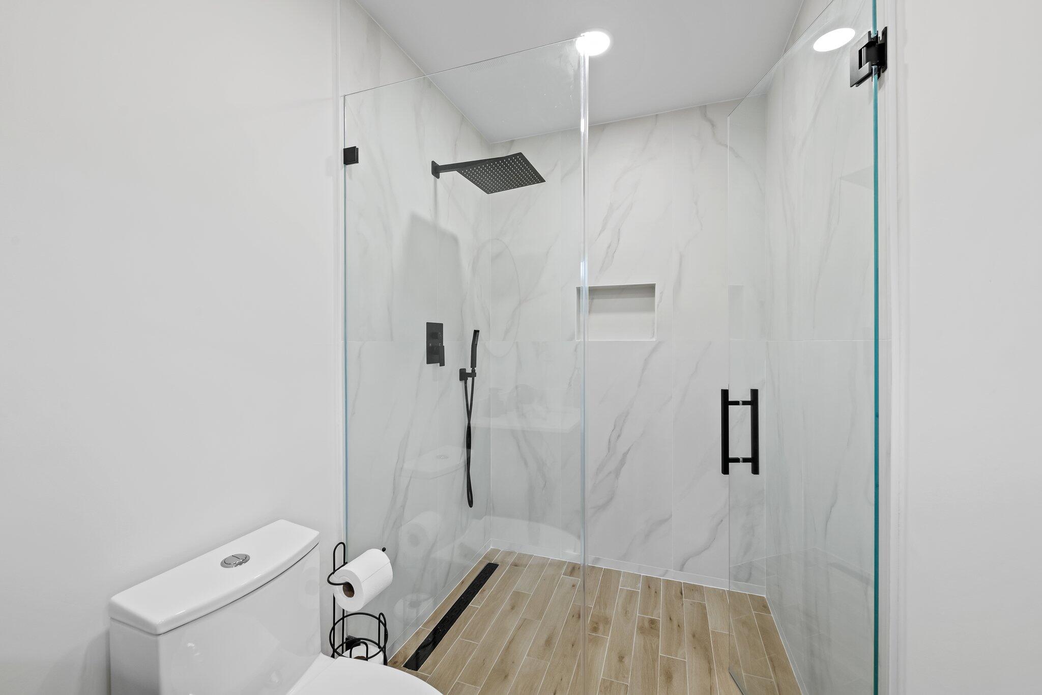 11937 Sandlake Drive Boca Raton, FL 33428 - Photo 41 of 54 a bathroom with a sink a toilet and shower