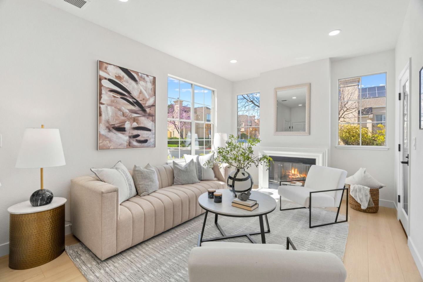a living room with furniture and a potted plant