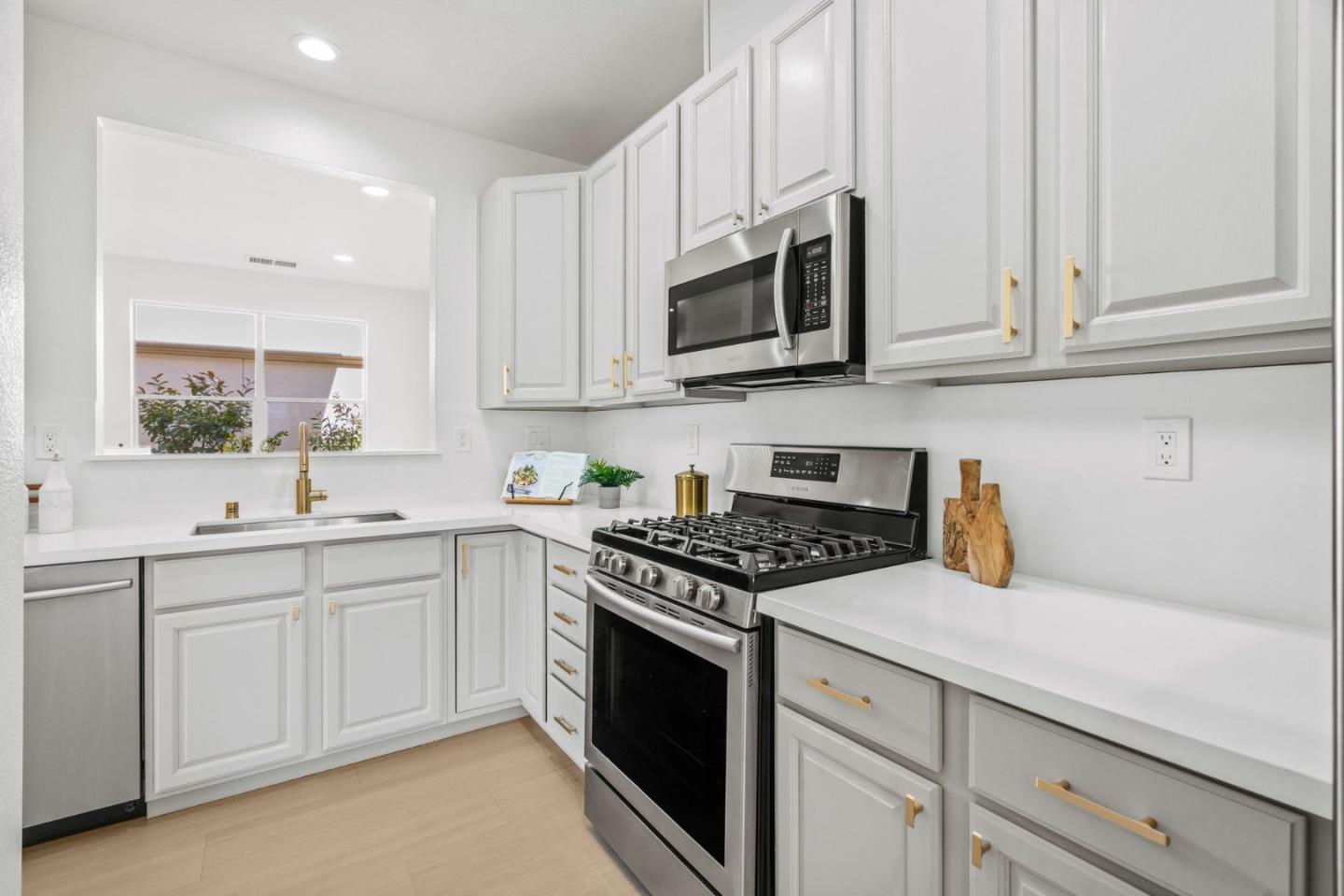 107 Beacon Street Mountain View, CA 94040 - Photo 12 of 55 a kitchen with stainless steel appliances granite countertop white cabinets a sink and dishwasher