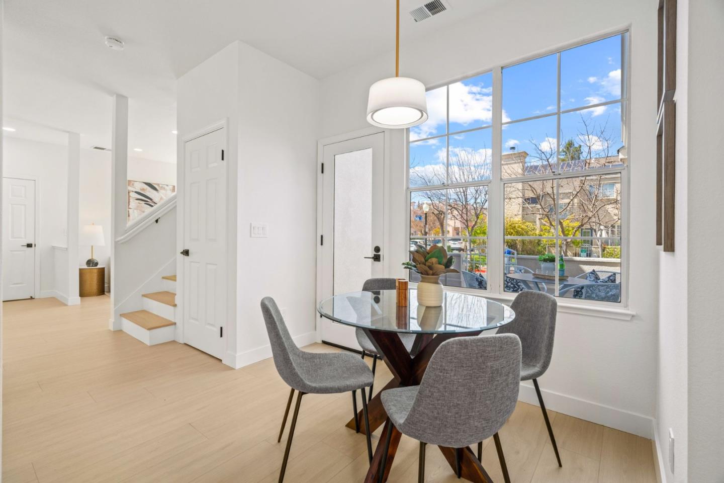 107 Beacon Street Mountain View, CA 94040 - Photo 15 of 55 a view of a dining room with furniture wooden floor and chandelier