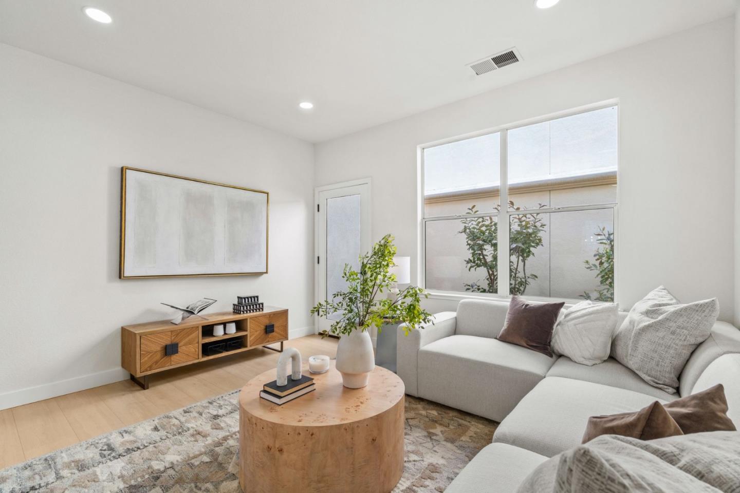 107 Beacon Street Mountain View, CA 94040 - Photo 19 of 55 a living room with furniture and a large window
