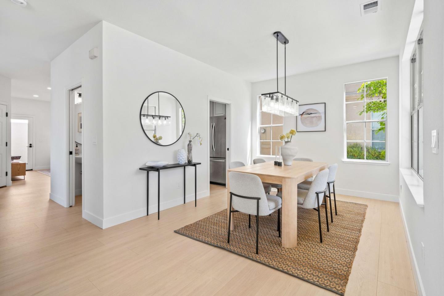 107 Beacon Street Mountain View, CA 94040 - Photo 5 of 55 a dining room with furniture a chandelier and wooden floor