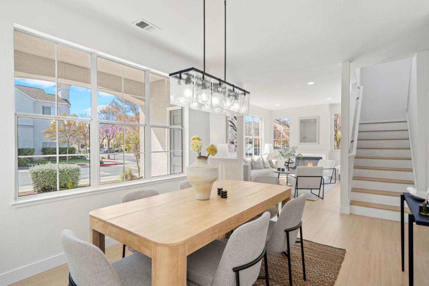 107 Beacon Street Mountain View, CA 94040 - Photo 7 of 55 a dining room with furniture a chandelier and wooden floor