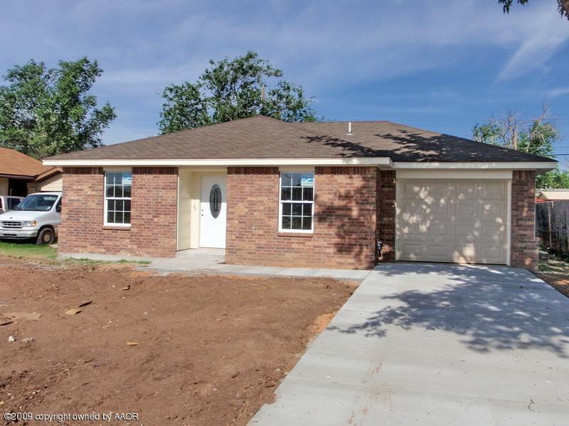 4612 South Hughes Street Amarillo, TX 79110 - Photo 1 of 4 front view of a house with a garage