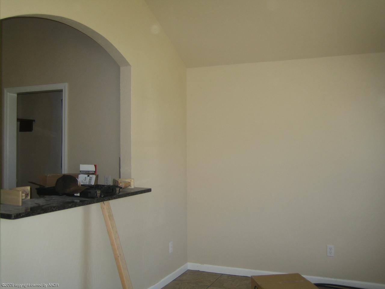 4612 South Hughes Street Amarillo, TX 79110 - Photo 2 of 4 a bathroom with a sink and a mirror