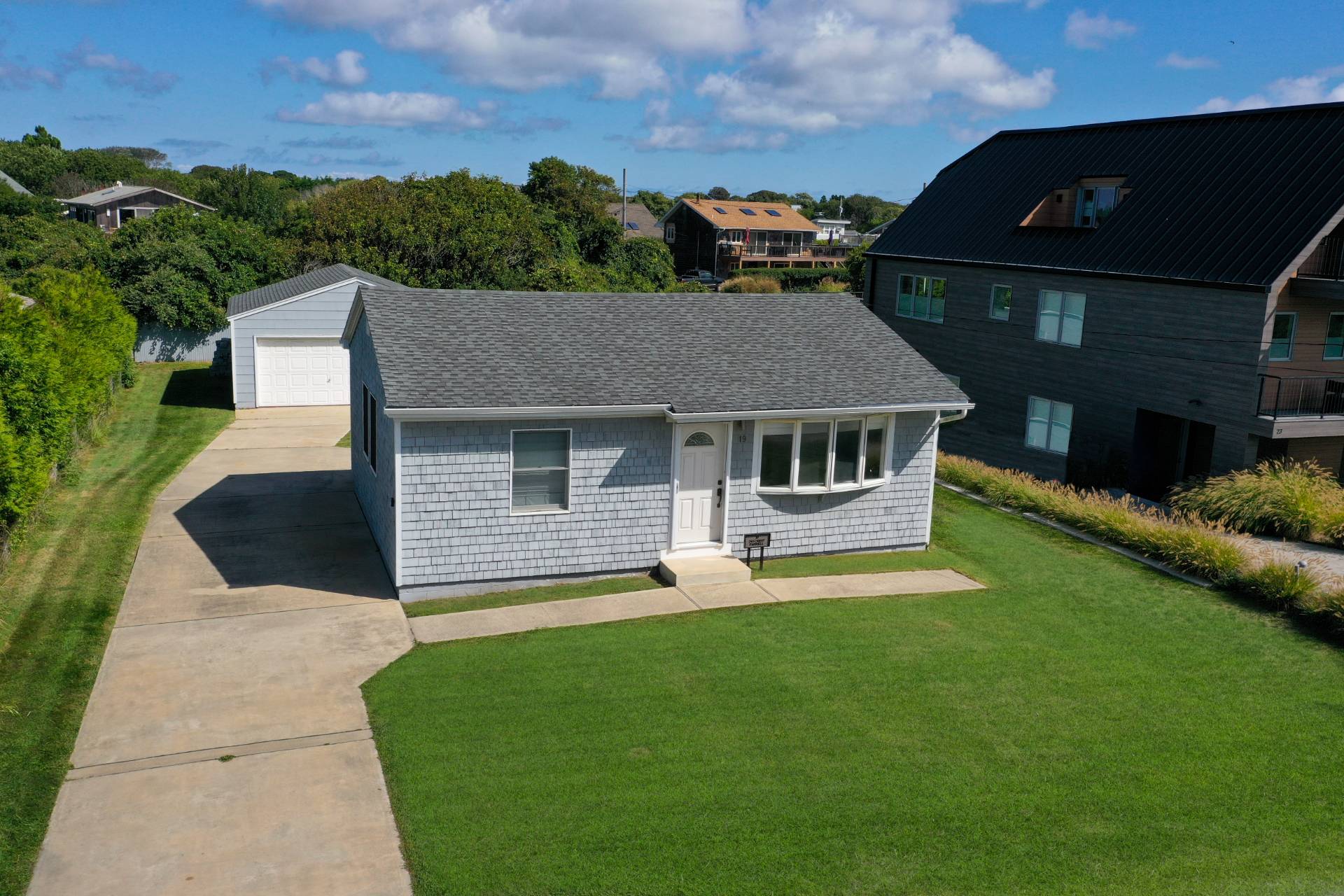 19 Deforest Road Montauk, NY 11954 - Photo 15 of 20 a front view of a house with a yard