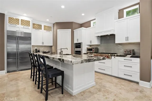 a view of backyard with seating space and trees