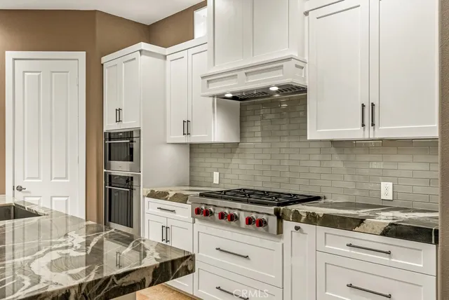 a large spacious bathroom with a large tub and sink