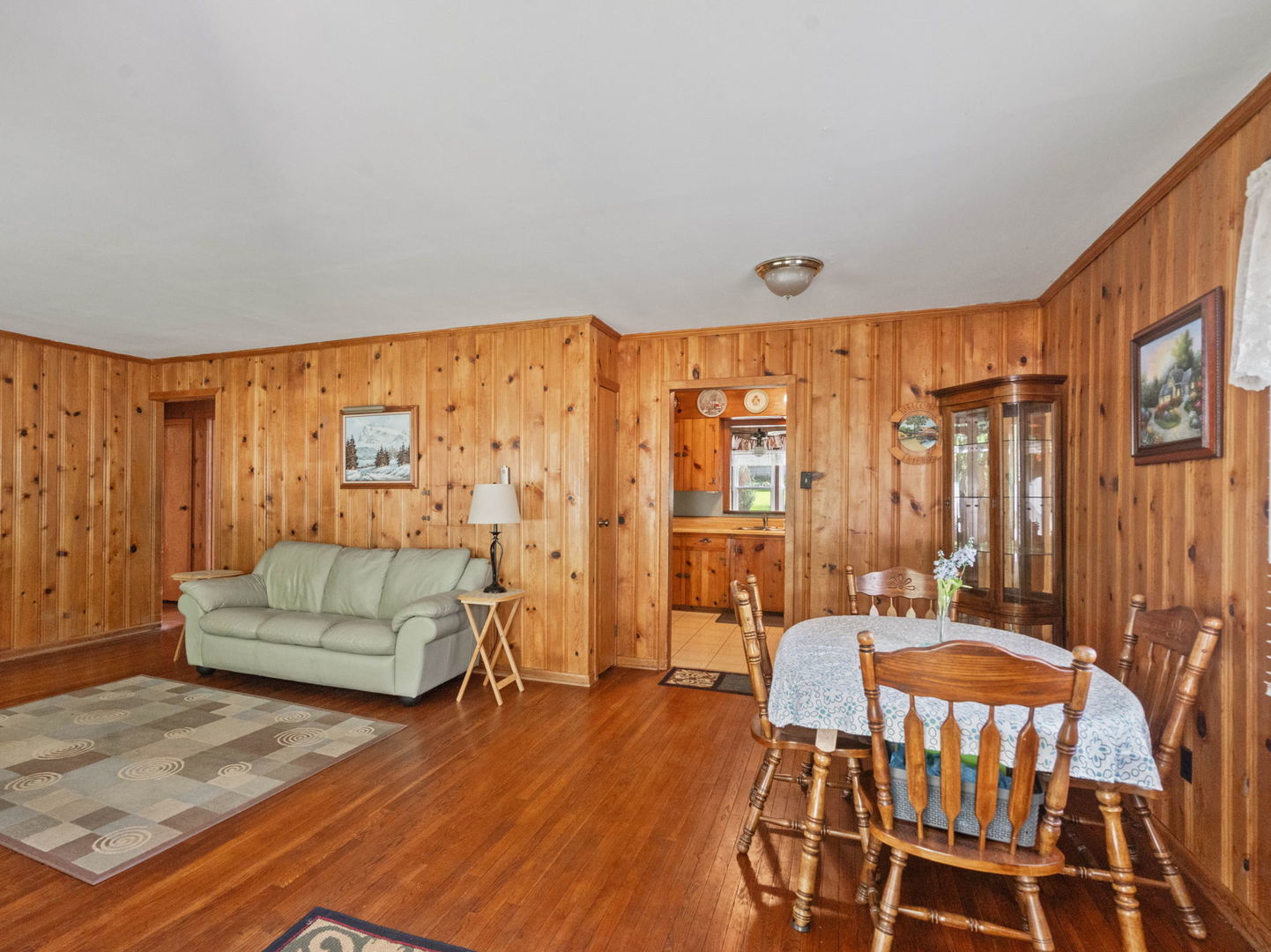 583 Riedy Road Lisle, IL 60532 - Photo 3 of 24 a living room with furniture and a wooden floor