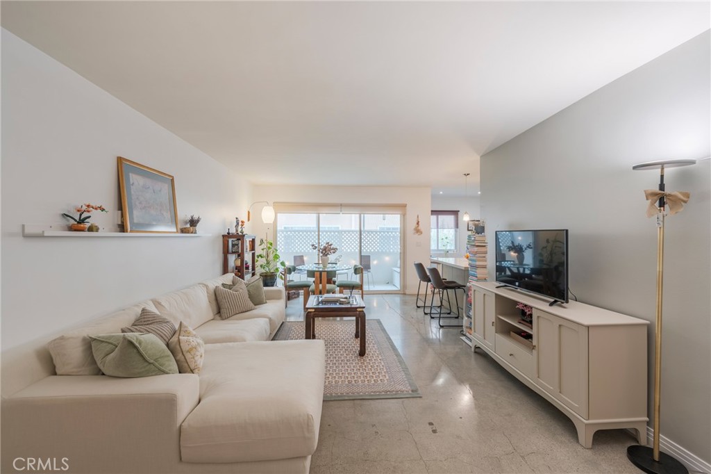 8710 Delgany Avenue, Unit 3 Playa del Rey, CA 90293 - Photo 1 of 34 a living room with furniture and a flat screen tv