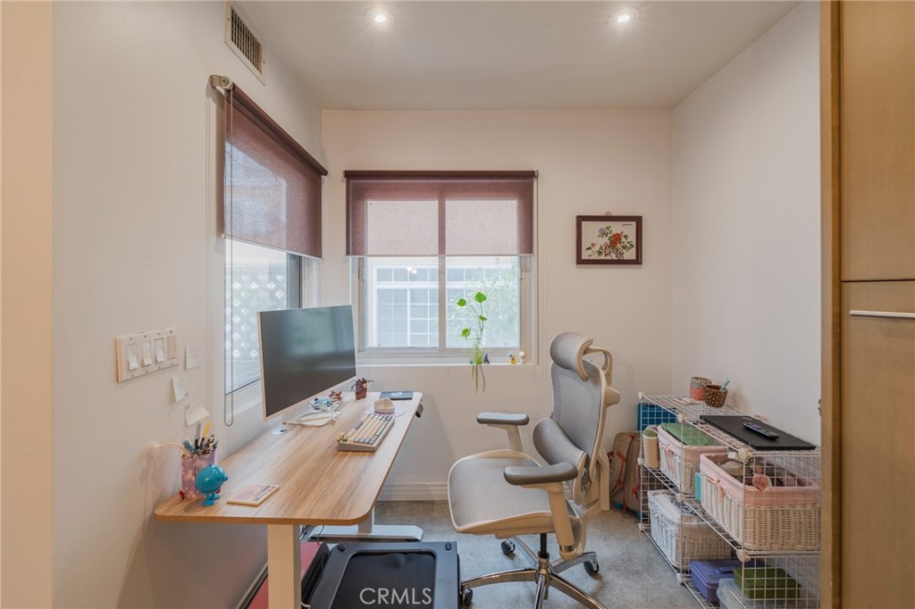 8710 Delgany Avenue, Unit 3 Playa del Rey, CA 90293 - Photo 16 of 34 a view of a workspace with furniture and a window