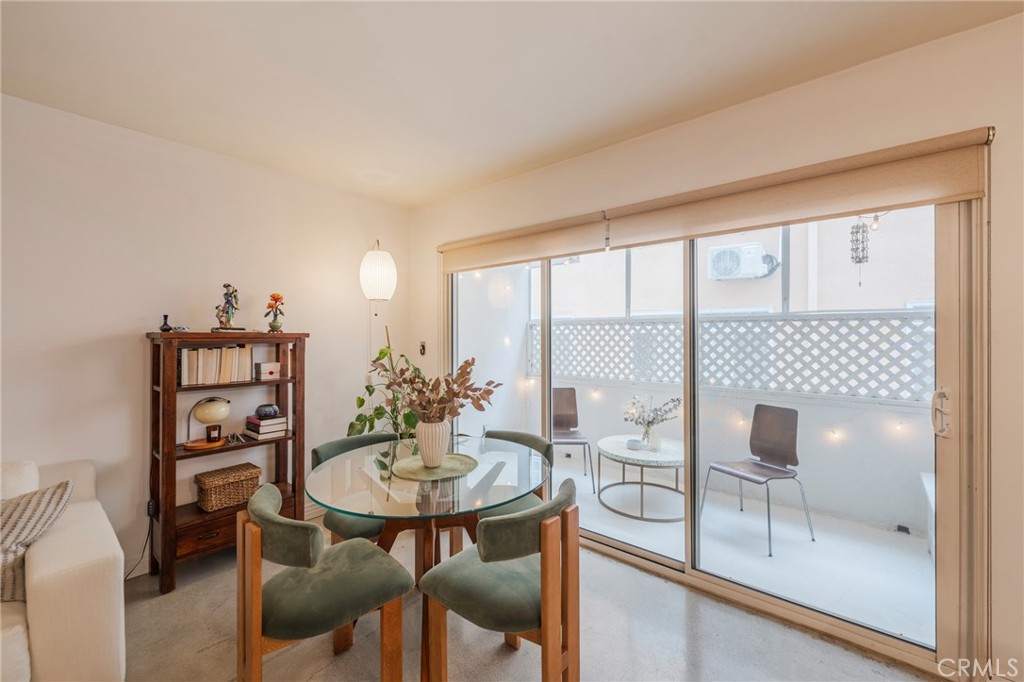 8710 Delgany Avenue, Unit 3 Playa del Rey, CA 90293 - Photo 17 of 34 a view of a dining room with furniture and wooden floor