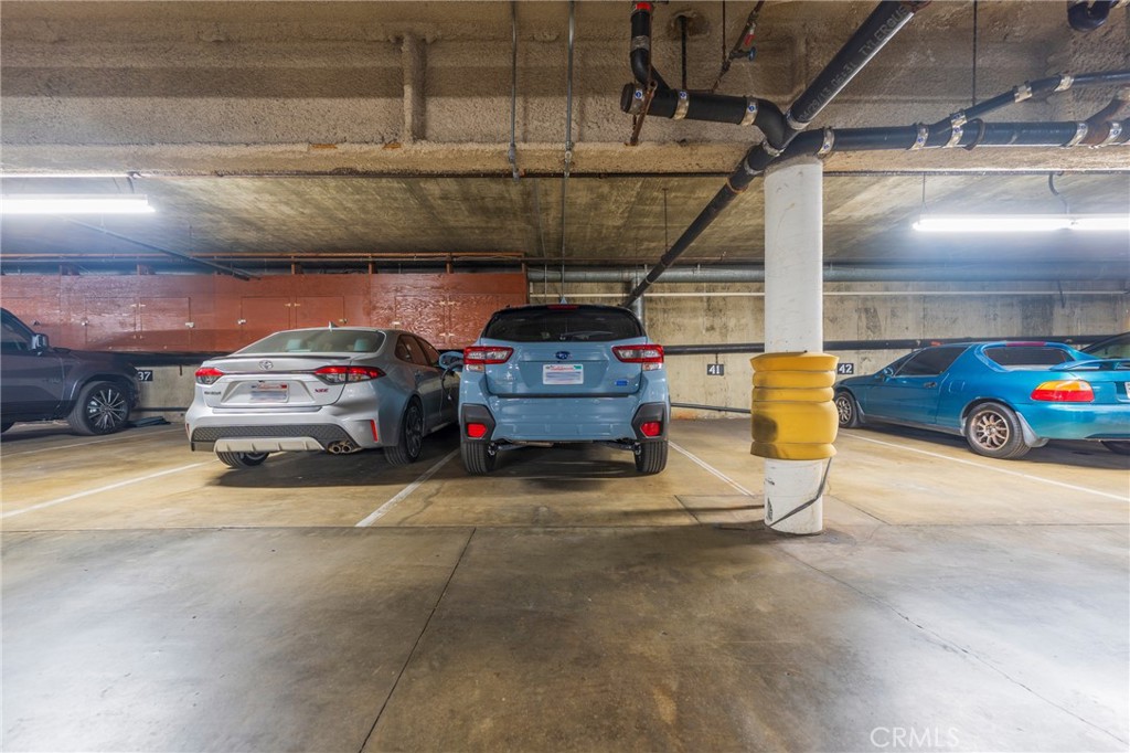 8710 Delgany Avenue, Unit 3 Playa del Rey, CA 90293 - Photo 28 of 34 a view of parking garage with cars parked