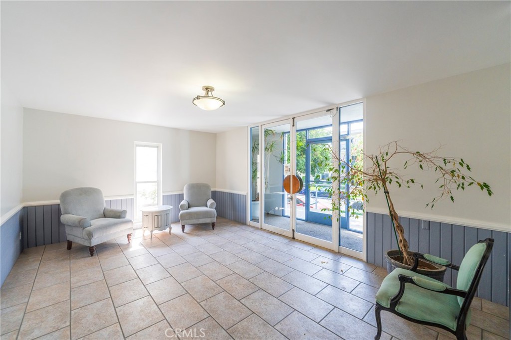 8710 Delgany Avenue, Unit 3 Playa del Rey, CA 90293 - Photo 30 of 34 a living room with furniture and a large window