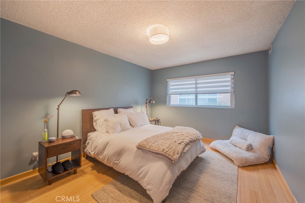 8710 Delgany Avenue, Unit 3 Playa del Rey, CA 90293 - Photo 3 of 34 a bedroom with a bed and a night stand