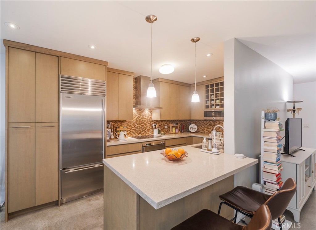 8710 Delgany Avenue, Unit 3 Playa del Rey, CA 90293 - Photo 9 of 34 a kitchen with kitchen island a sink appliances and cabinets