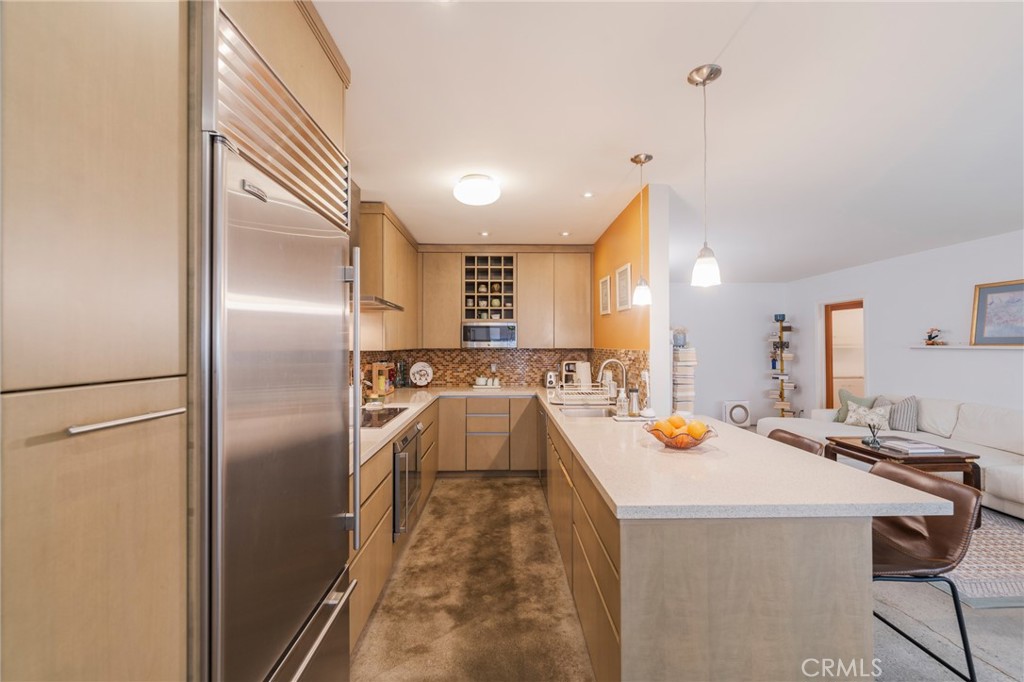 8710 Delgany Avenue, Unit 3 Playa del Rey, CA 90293 - Photo 10 of 34 a view of a kitchen with a sink a refrigerator and a window