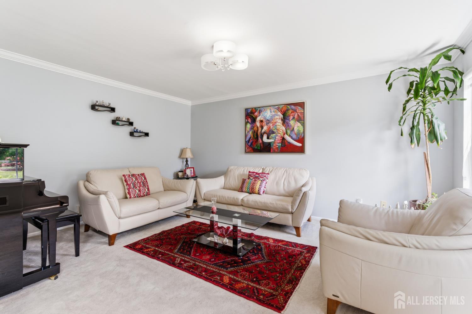 26 Alexis Lane Edison, NJ 08820 - Photo 6 of 39 a living room with furniture and a potted plant
