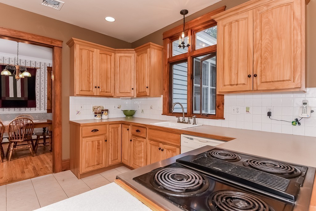 20 Harriman Road Merrimac, MA 01860 - Photo 12 of 30 a kitchen with stainless steel appliances granite countertop a stove and a sink