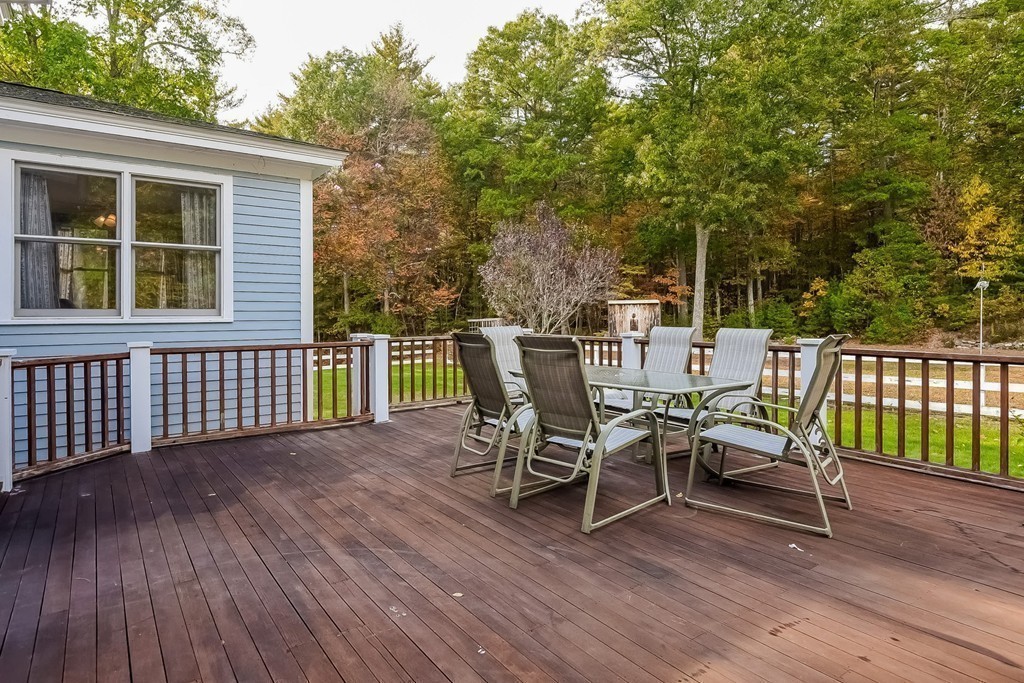 20 Harriman Road Merrimac, MA 01860 - Photo 20 of 30 a view of a deck with table and chairs and wooden floor