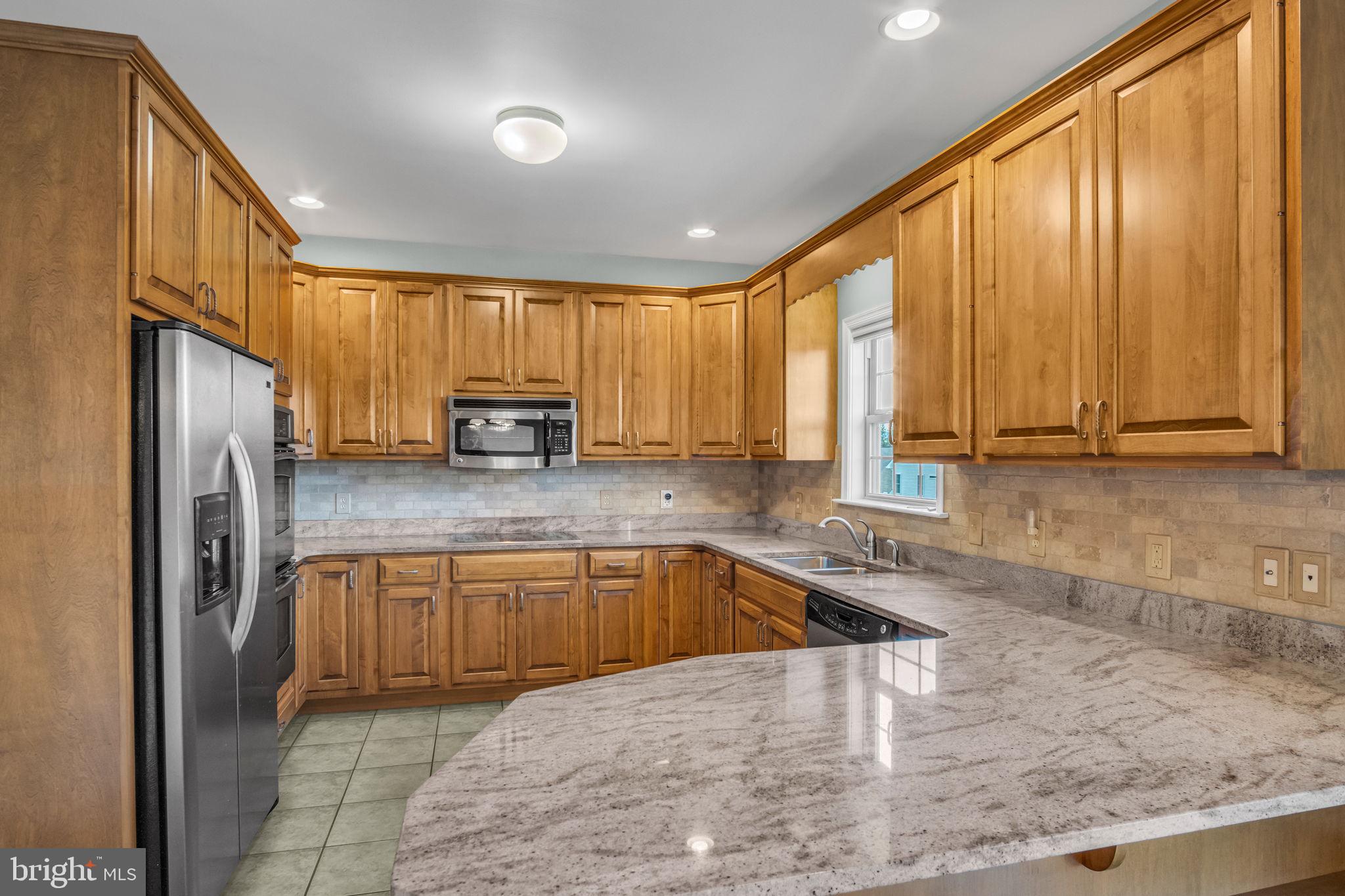 4 Over View Carlisle, PA 17013 - Photo 23 of 73 a kitchen with stainless steel appliances granite countertop a refrigerator a sink and a granite counter tops