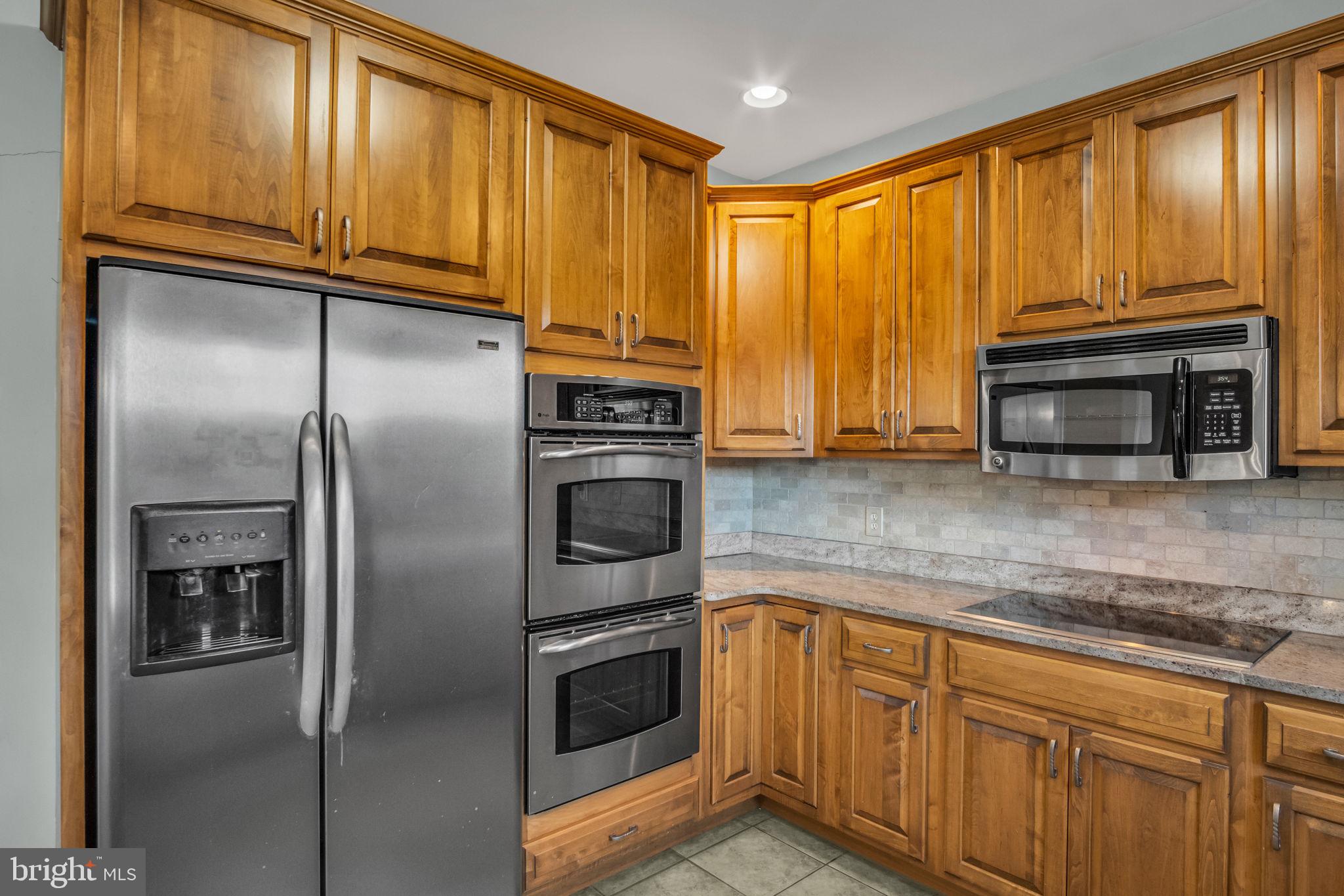 4 Over View Carlisle, PA 17013 - Photo 24 of 73 a kitchen with stainless steel appliances granite countertop a refrigerator a stove and a sink with cabinets
