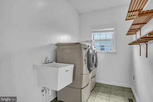 a bathroom with a granite countertop toilet sink and mirror