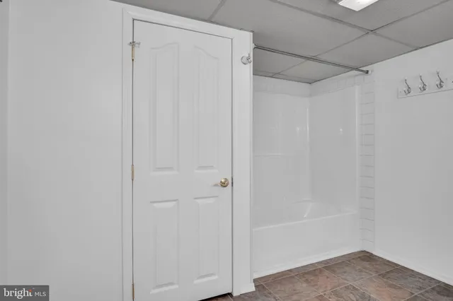 an aerial view of residential houses with outdoor space and swimming pool