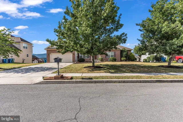 an aerial view of residential houses with outdoor space and river view