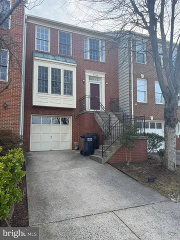 a view of a house with a yard and garage