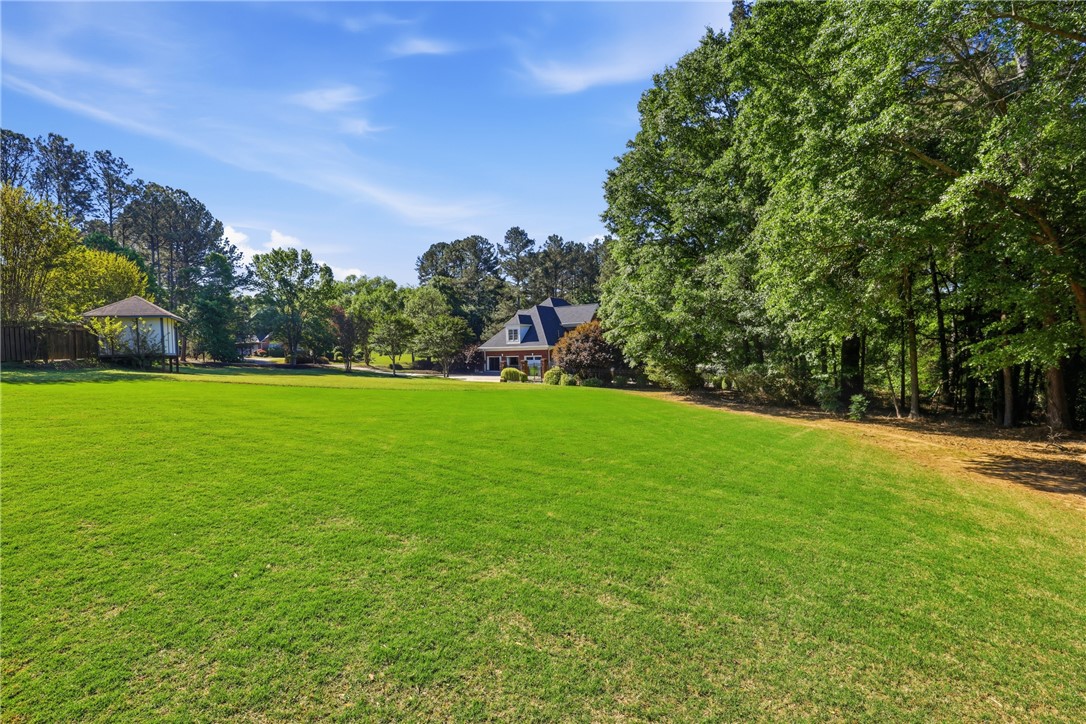 103 5 Knoll Court Anderson, SC 29621 - Photo 28 of 33 Vast green lawn offers ample space for outdoor enjoyment and recreation.