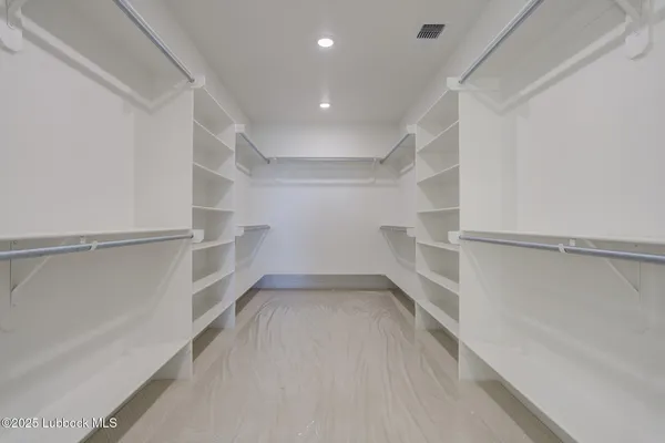 a view of an empty room and a fireplace