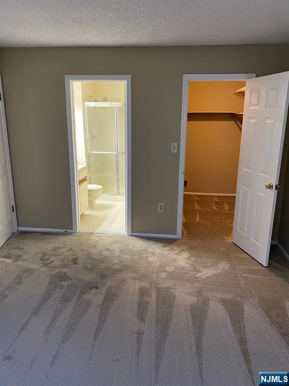 472 Quince Court Mahwah, NJ 07430 - Photo 4 of 8 an empty room with a door