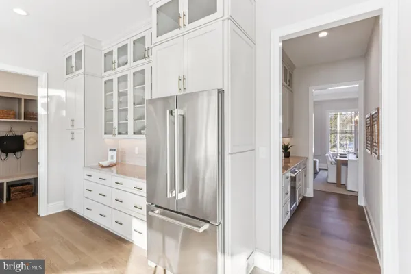 a view of walk in closet with white walls