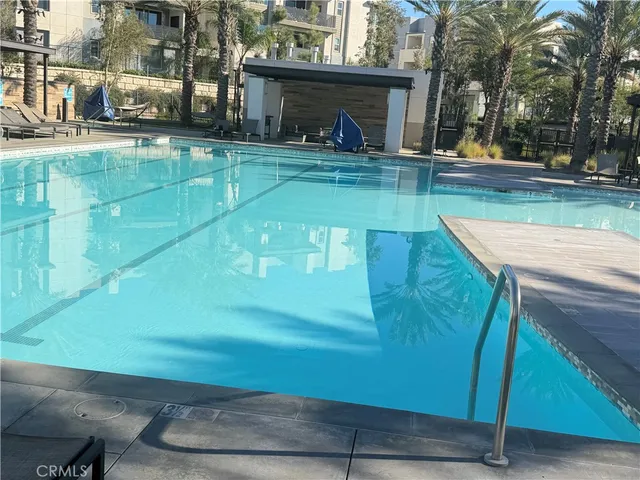 a view of a backyard with sitting area