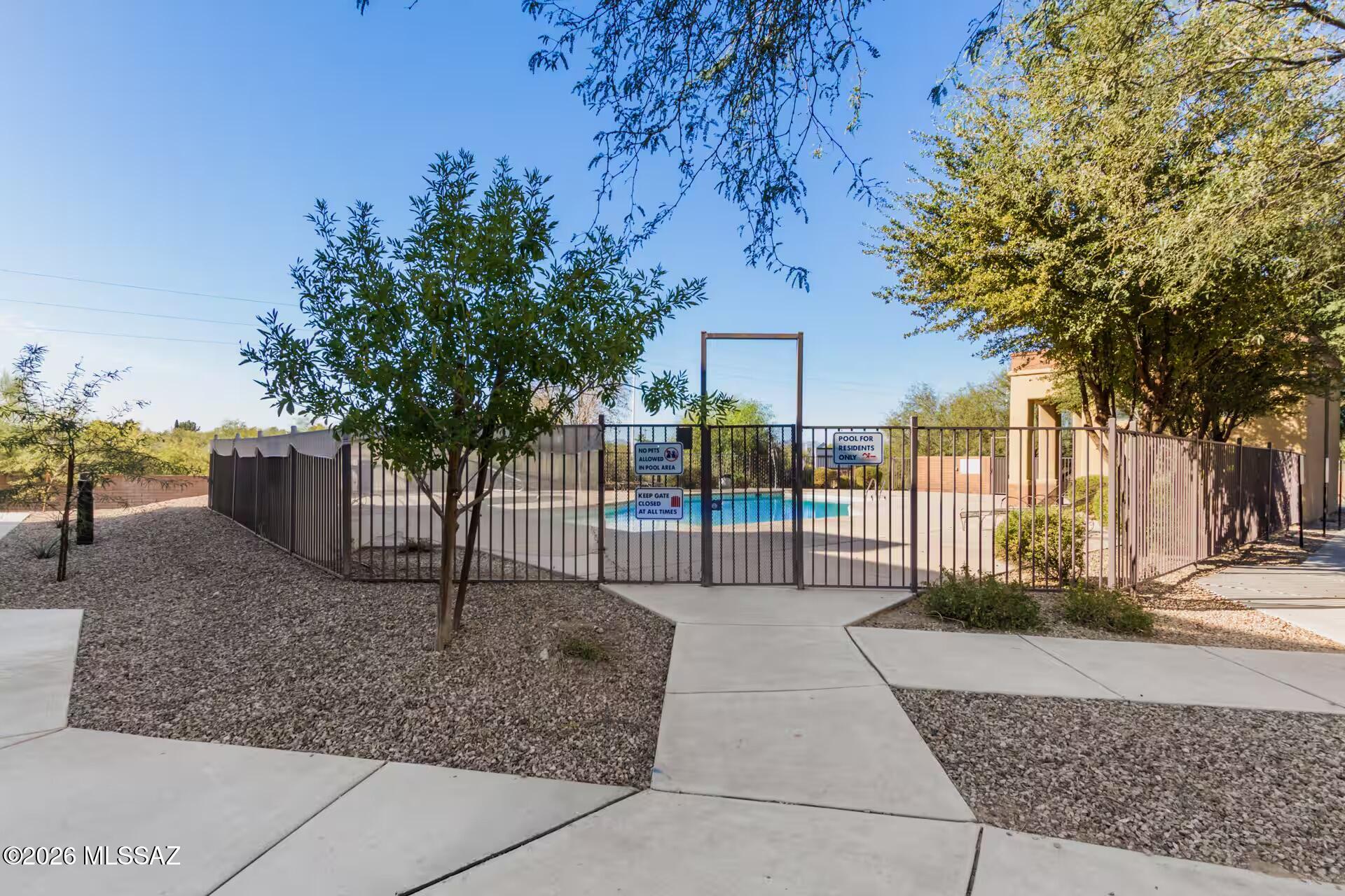 2036 East River Road, Unit 104 Tucson, AZ 85718 - Photo 21 of 23 a view of a park with iron fence
