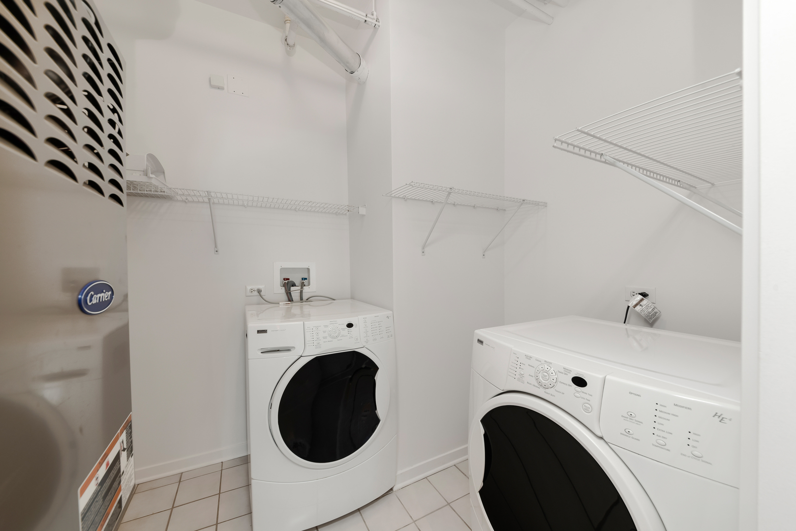 4350 North Broadway, Unit 607 Chicago, IL 60613 - Photo 14 of 18 a utility room with dryer and washer