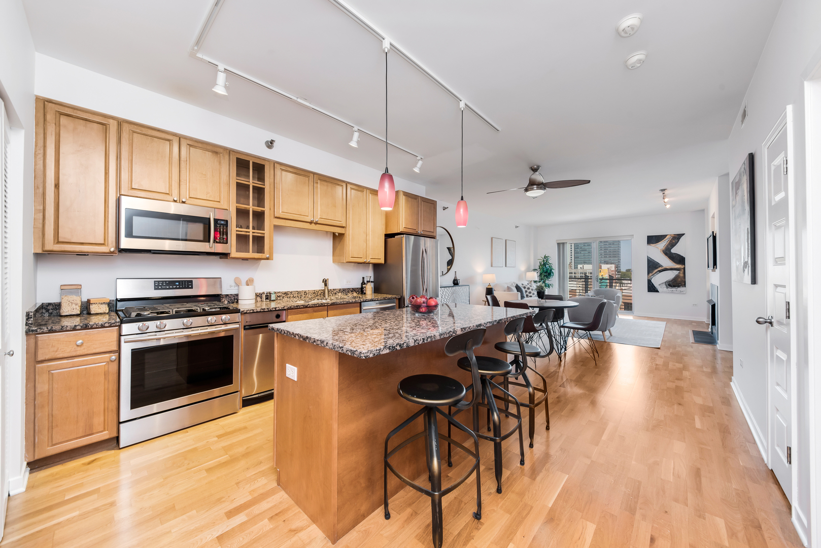 4350 North Broadway, Unit 607 Chicago, IL 60613 - Photo 5 of 18 a kitchen with lots of counter top space and stainless steel appliances